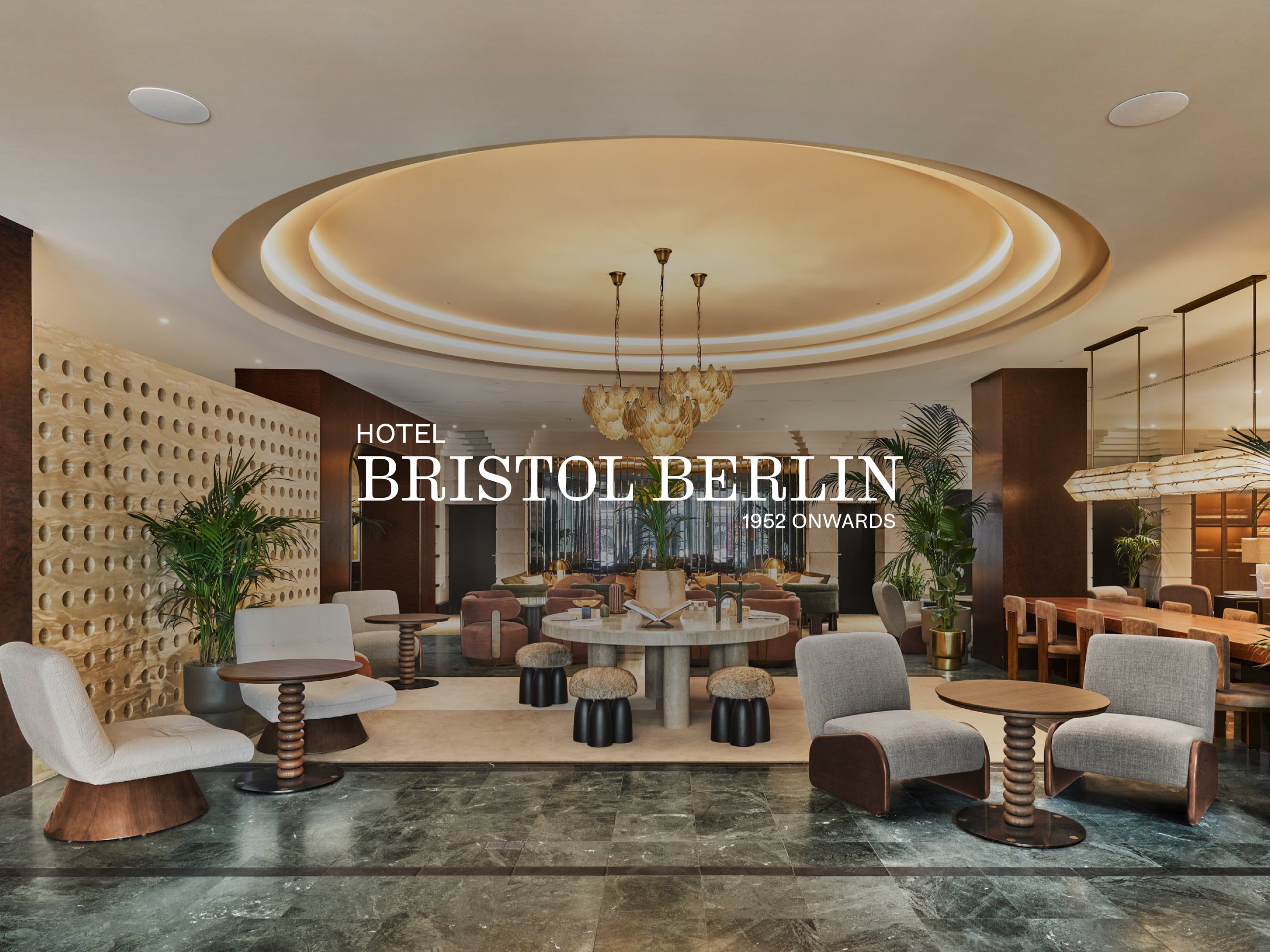 Hotel Bristol Berlin lobby with logo overlay.